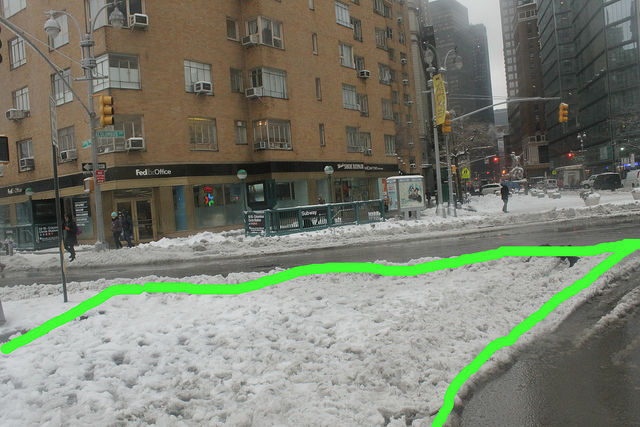 A sneckdown with a green line drawn around it to highlight designable space